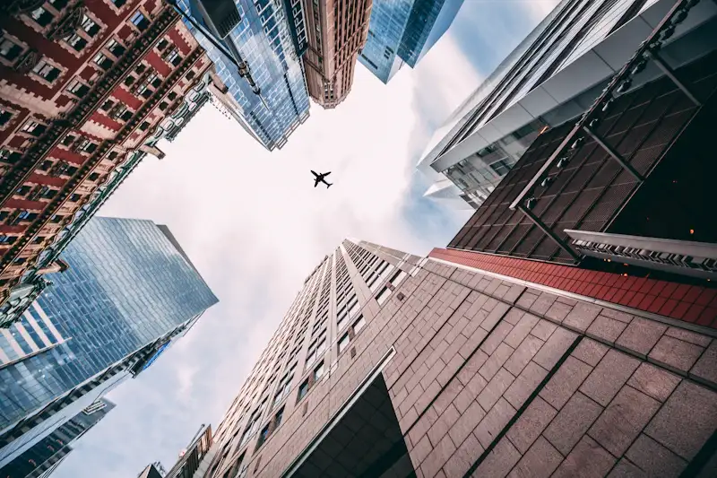 Airplane flying over New York City — US Visa